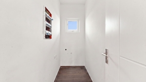 Reina Sophia Model Luca Unit 20 utility room in Aruba with a small window, white walls, tiled flooring, electrical panel, and utility connections.